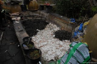Bathroom debris being covered with pond filter stones