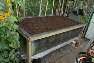 Tank filled with compost