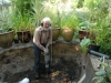 Breaking the concrete pond bottom.